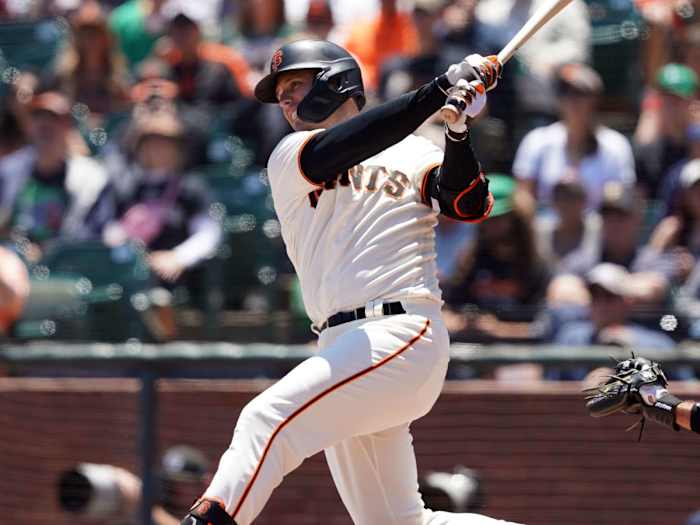 Buster Posey swings the bat